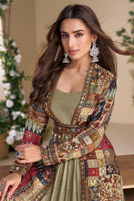 Sage green gown with multicoloured jacket and belt