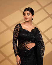 Black sequinned saree with long sleeves blouse