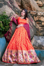 Orange jacquard silk and pink bandhani Lehenga