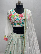 Sage green with a pop of floral colour lehenga