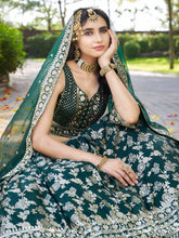 Dola silk jacquard Lehenga in green