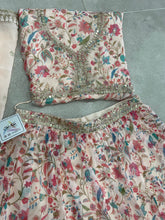 Tinge of cream and pink organza floral Lehenga