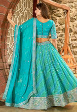 Blue and green Leheriya print organza lehenga