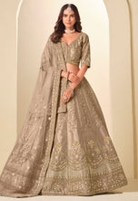 Champagne and gold embroidered art silk Lehenga