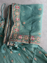 Mint Green Embroidered tissue fabric Lehenga