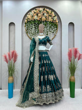 Emerald green and gold motifs lehenga