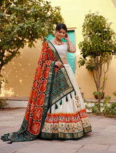 Tussar silk and patola print Lehenga in white and orange