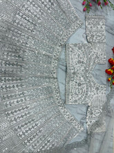 White lehenga with silver embroidery