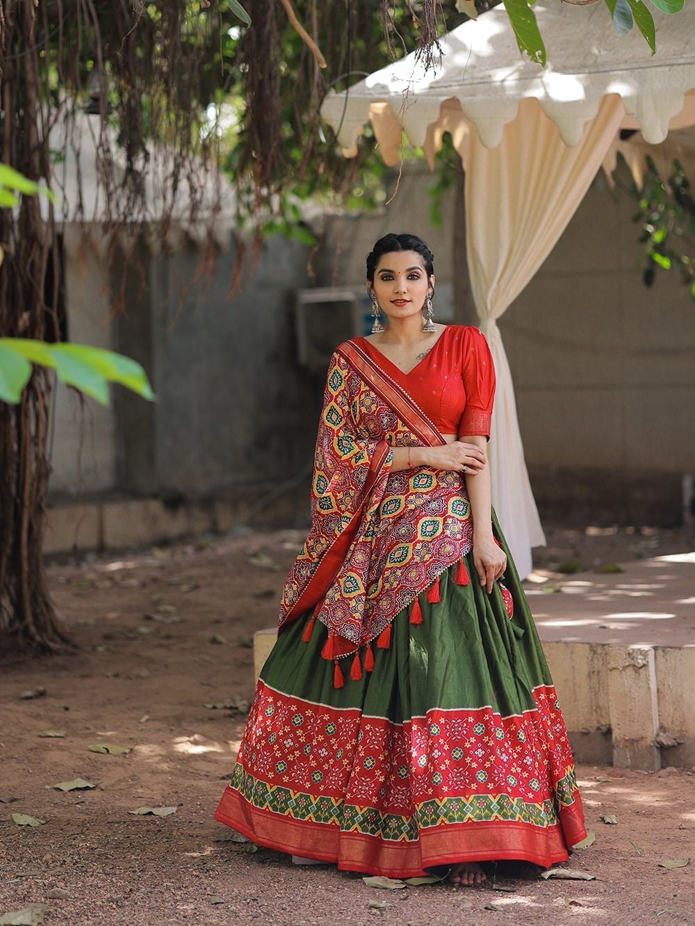 Traditional dola silk twirling lehengas in mehendi green