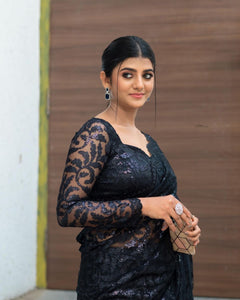 Black sequinned saree with long sleeves blouse