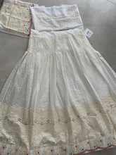 White lehenga with thread work and green bandhani dupatta