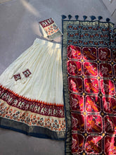 Tussar silk and patola print Lehenga in white and maroon