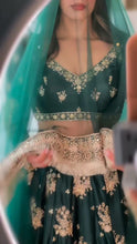 Emerald green and gold motifs lehenga