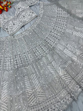 White lehenga with silver embroidery