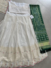 White lehenga with thread work and green bandhani dupatta