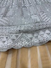 White lehenga with silver embroidery
