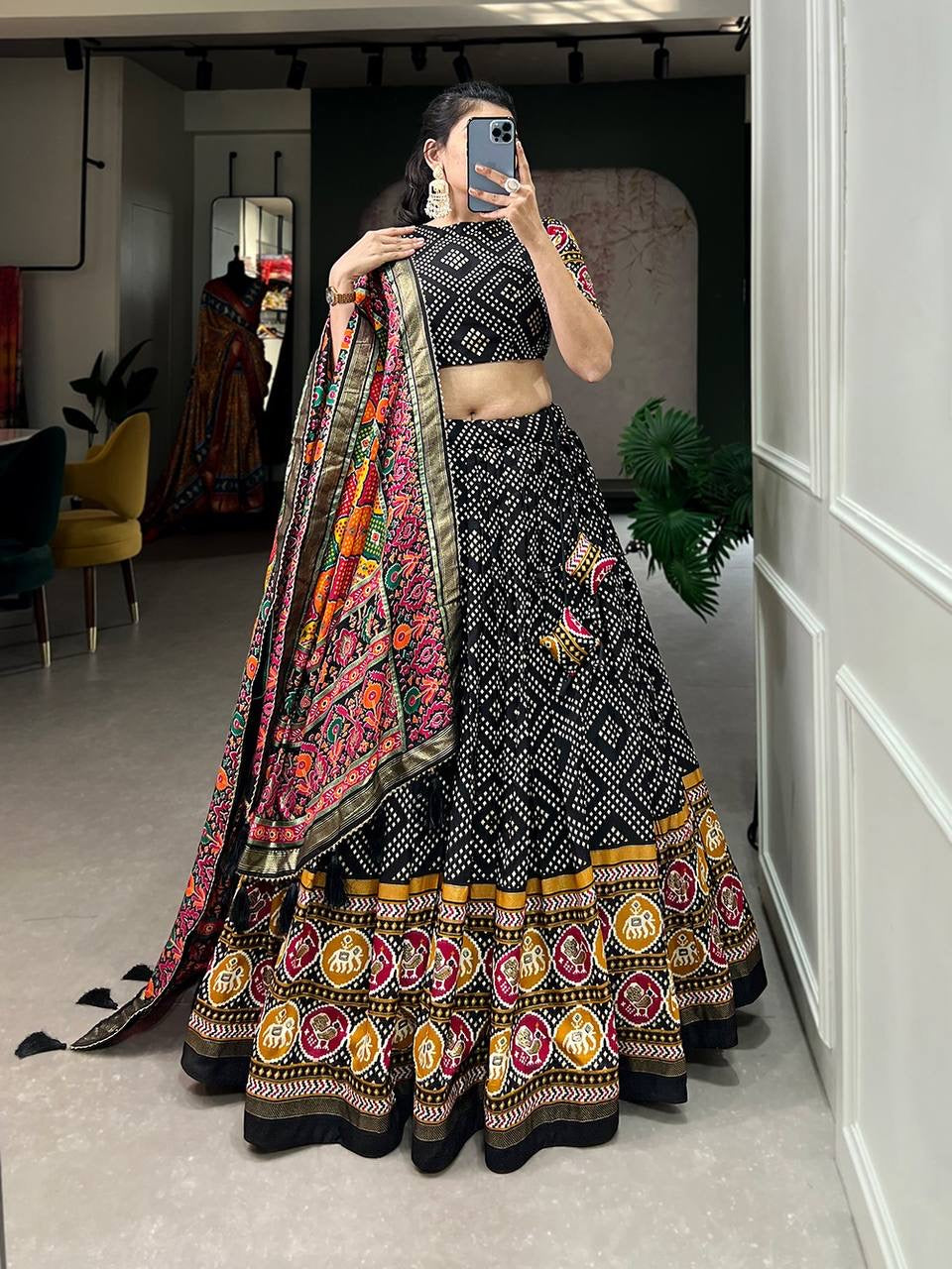 Royal ensemble of bandhej and patola print Lehenga in black