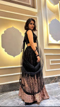 The stunner in Georgette - Black and gold sequins Lehenga