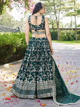 Dola silk jacquard Lehenga in green