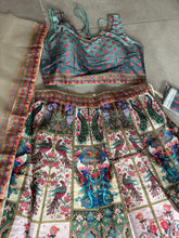 Boutique collection - vibrant peacock stone work Lehenga