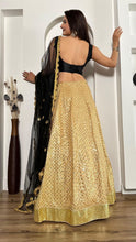 Black and gold silk Lehenga