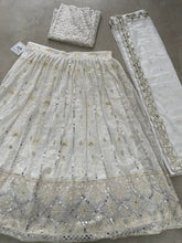 Beautiful white Lehenga with silver sequins