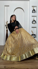 Black and gold silk Lehenga