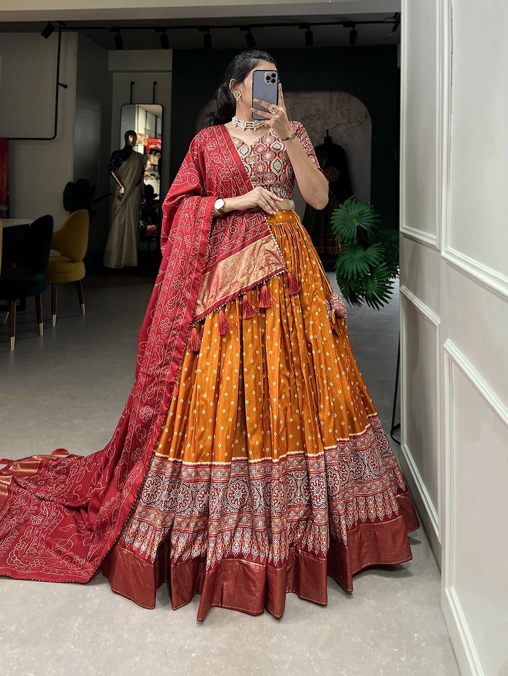Sangeet nights - dola silk with bandhani and ajrakh print chaniya cholis (skirt stitched) in orange.