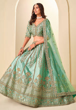 Sea green and gold embroidered art silk Lehenga