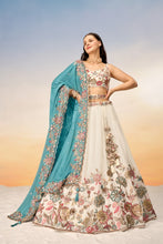 White embroidered Lehenga with sea green dupatta