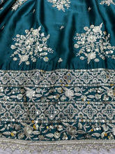 Emerald green and gold motifs lehenga