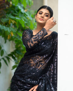 Black sequinned saree with long sleeves blouse