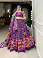 Royal ensemble of bandhej and patola print Lehenga in purple