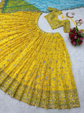 Yellow sequins Lehenga paired with blue net dupatta