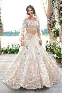 Ivory lehenga with peacock and sequin embroidery