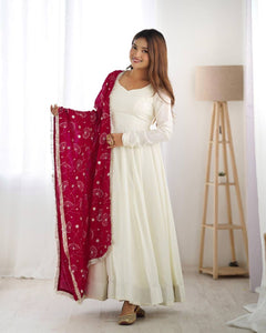 Silk off white gown with dark pink lace dupatta