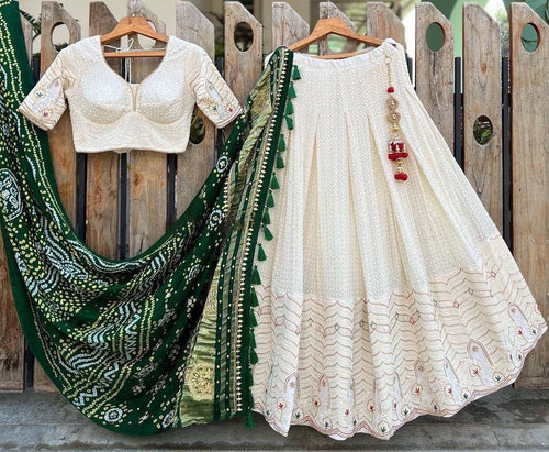 White lehenga with thread work and green bandhani dupatta