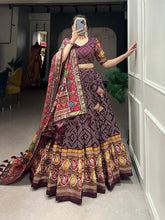 Royal ensemble of bandhej and patola print Lehenga in wine