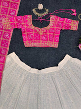 White and pink bandhani lehenga