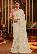 Woven art silk sequinned saree in white