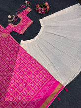 White and pink bandhani lehenga