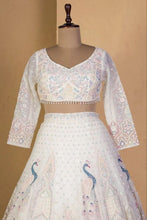 Ivory lehenga with peacock and sequin embroidery