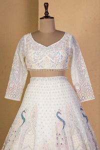 Ivory lehenga with peacock and sequin embroidery