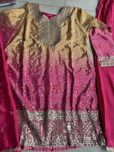 Pink and yellow bandhani print flared pants suit