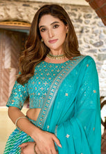Blue and green Leheriya print organza lehenga