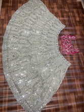 Exquisite diamond silk sage green Lehenga with contrasting colours