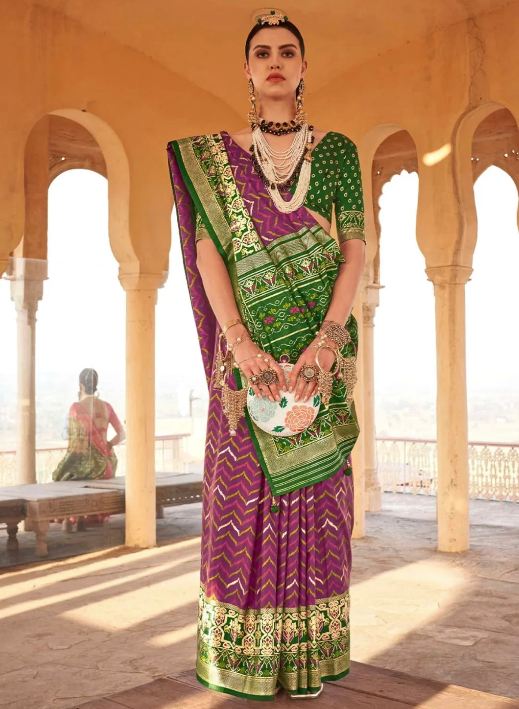 Classic silk patola print saree in green and wine