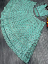 Sea green sequinned Lehenga with belt