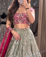 Exquisite diamond silk sage green Lehenga with contrasting colours