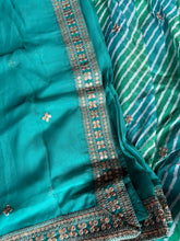 Blue and green Leheriya print organza lehenga
